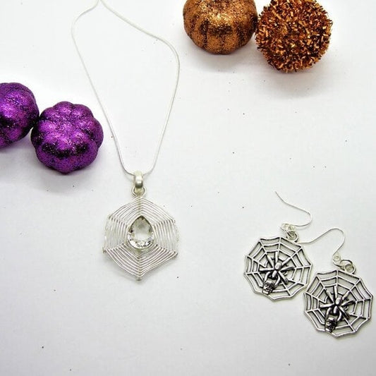 Chrome silver spiderweb pendant with crystal clear gem and earrings